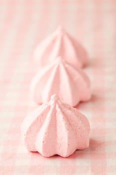 Close-up of delicious pink meringue. Studio shot.
