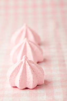 Close-up of delicious pink meringue. Studio shot.