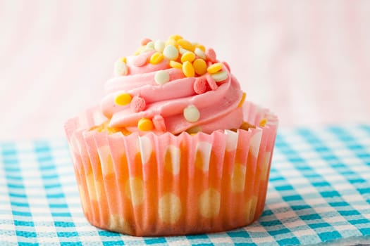 Close-up of delicious pink muffin. Studio shot.
