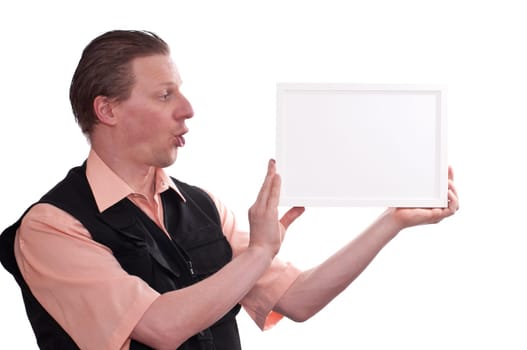 A man as a photographer looks surprised and holds up a white frame