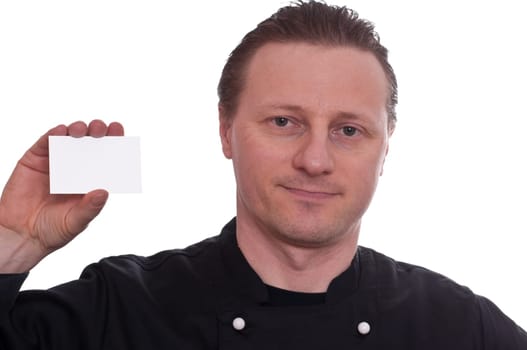 A man as a cook holds up a blank white business card