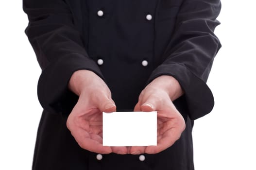 A chef shows a business card with both hands with a copy space