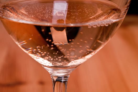 Carbonation in a wine glass with rosé wine