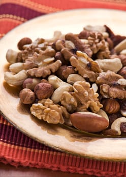 Mixed nuts on a plate close up shoot
