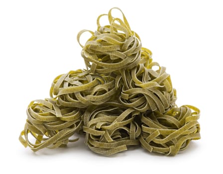 Green Italian tagliatelle isolated on white close up