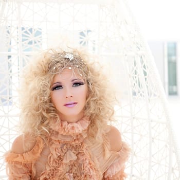 Baroque haute couture woman portrait with vampire inspiration in hammock