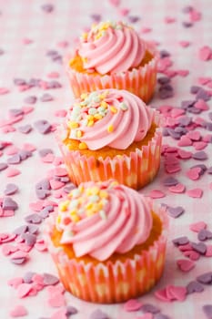 Close-up of delicious pink muffins. Studio shot.