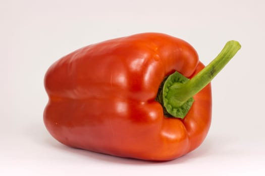 Bright red pepper isolated on white.