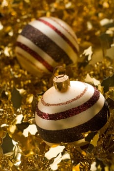christmas ornaments on golden background close up