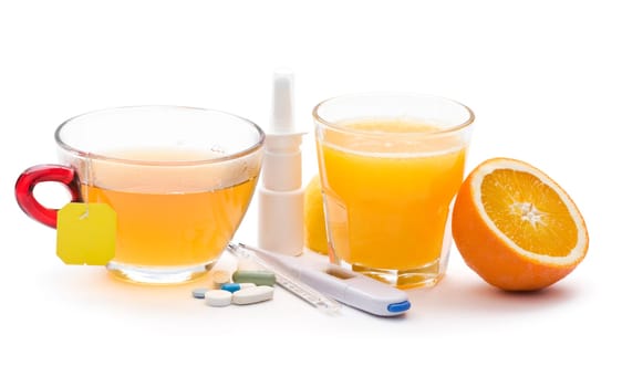 Pills, tea, juice and thermometer icolated on white close up