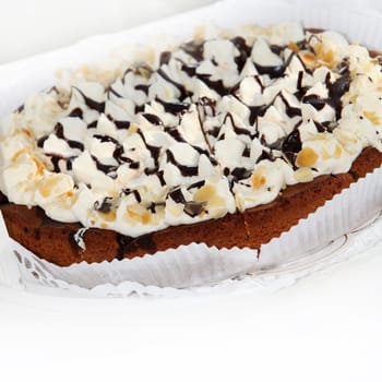 Deliscious Fresh Cake decorated with icing pinnacles drizzled with chocolate