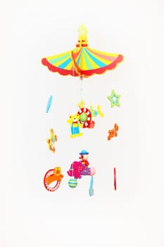 Colourful Hanging Toy Mobile with many suspended delicate shapes to be set in motion by air currents or by hand