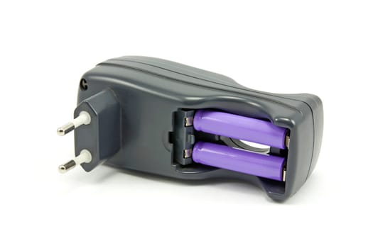 Quick charger and accumulators isolated on white