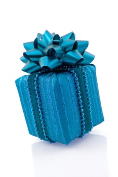 blue gift on white background with reflection