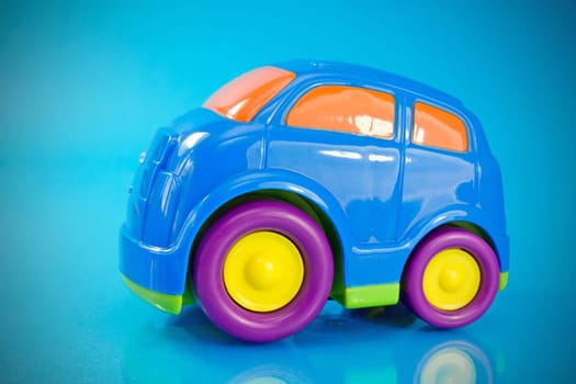 colorful car toy over a blue background