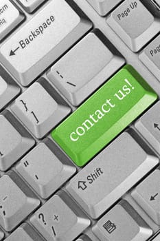 business concept. Keyboard green key -"contact us"""