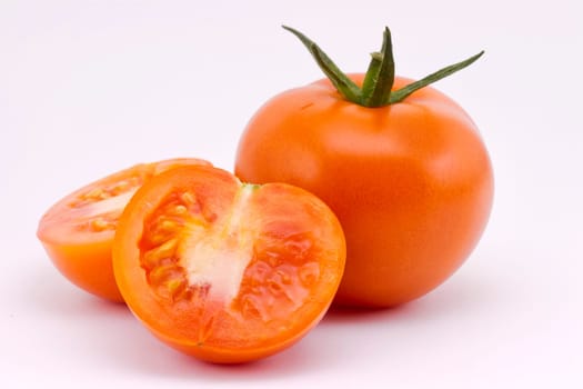 three red tomato vegetable isolated on white background