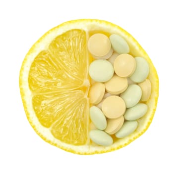 Close up of lemon and pills isolated - vitamin concept - vitamin c