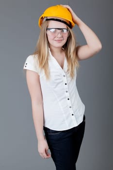 young happy girl.  little girl on a gray background
