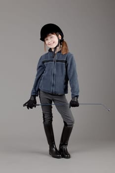 young happy girl.  little girl on a gray background