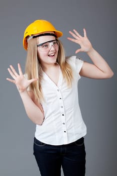 young happy girl.  little girl on a gray background