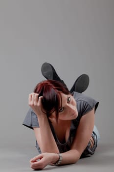 attractive smiling woman. Portrait of an attractive young woman.  lady posing on grey background.
