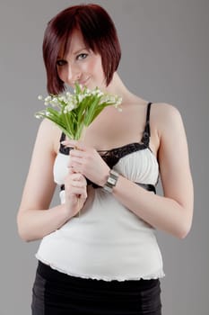 attractive smiling woman. Portrait of an attractive young woman.  lady posing on grey background.