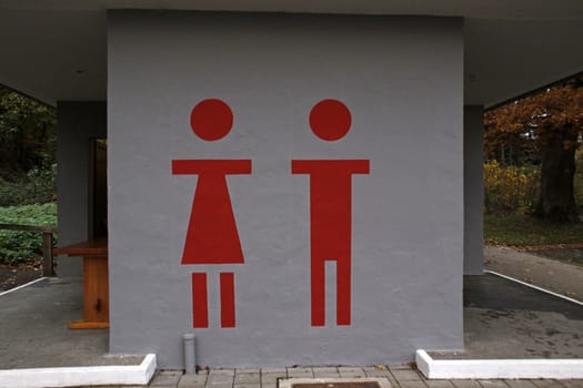 Large pictograms at a public toilet