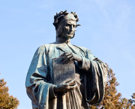 Statue of Dante holding Commedia book in Meridian Hill Park in Washington DC