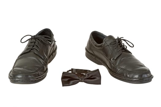 Men's shoes and men's bow tie isolated on white background
