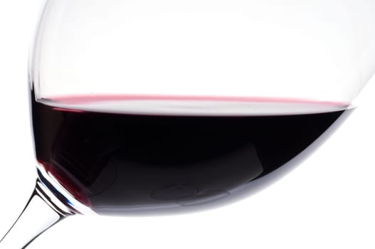 A close-up of Merlot red wine in a Bordeaux wine glass