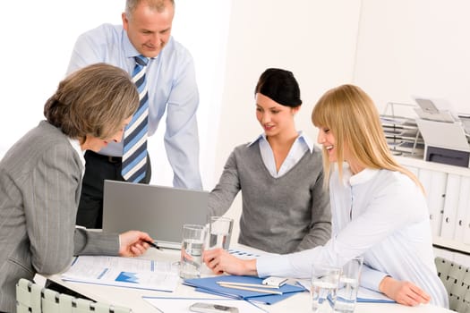 Business team meeting people around table brainstorming in office