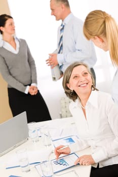 Sales meeting business people review reports consulting new strategy