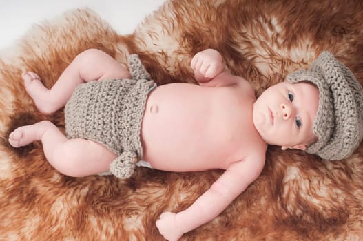 Shot of newborn baby lying on fur