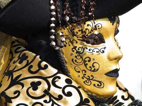 golden mask on the piaca st Marco in Venice during teh carnival