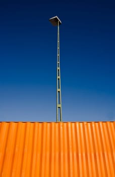 Orange Cargo Container towards blue sky