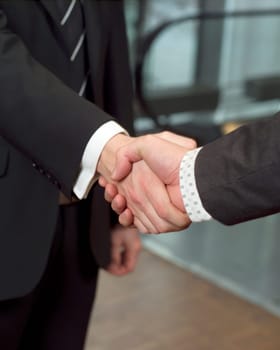 Close-up of a handshake with selective focus