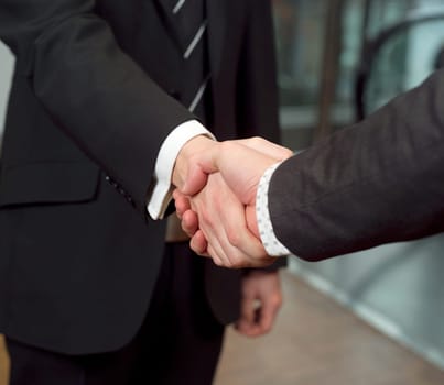 Close-up of a handshake with selective focus
