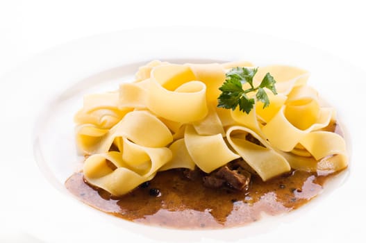 Fresh pasta with beef sauce close up