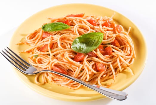 fresh spaghetti pasta with basil close up