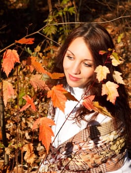 Young woman in the autumn forest