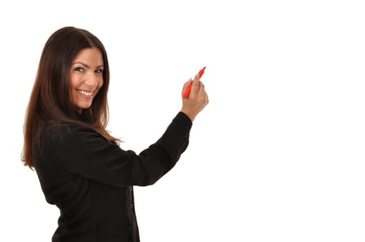 Attractive teacher looking at camera while writing
