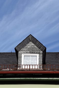 Pointed roof with slate and gutter