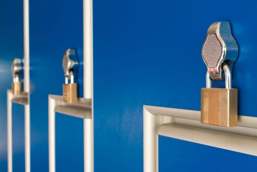 safety locks on blue industrial metal lockers