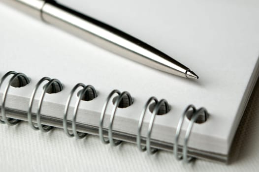 business notepad with pencil close up shoot