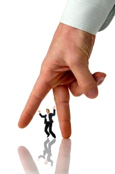 business women standing in between two fingers of mens hand concept