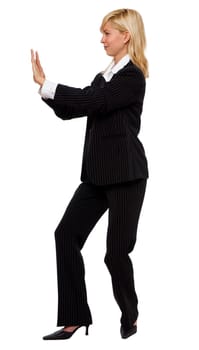 young blond business woman pushing concept, isolated on white
