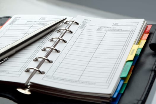 note book with pencil close up shoot