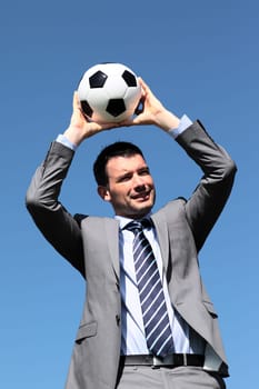 the coach with ball in blue sky in summer