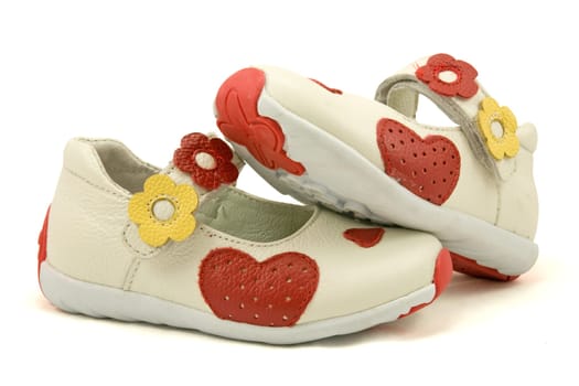 pair of baby shoes over a white background